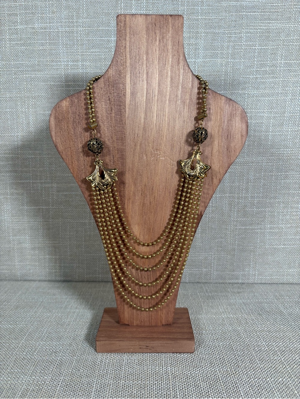Gold Multi-Strand Beaded Necklace with Filigree Leaves